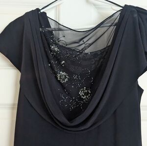 Gown for formal occassion. Shawl neck with mesh/lace bodice.